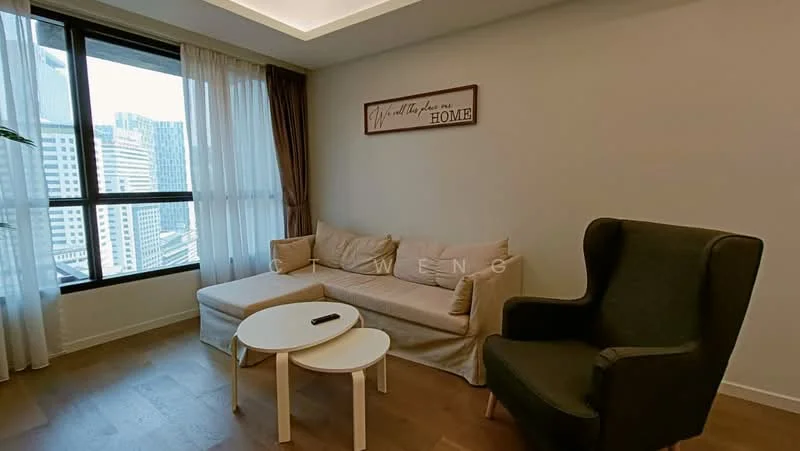 Living features: light wood flooring, white painted walls, tray ceiling with recessed lighting, floor-to-ceiling windows, sheer curtains, beige fabric sofa, green upholstered armchair, round white coffee table, decorative wall sign with text, area rug; style: modern; view: city.