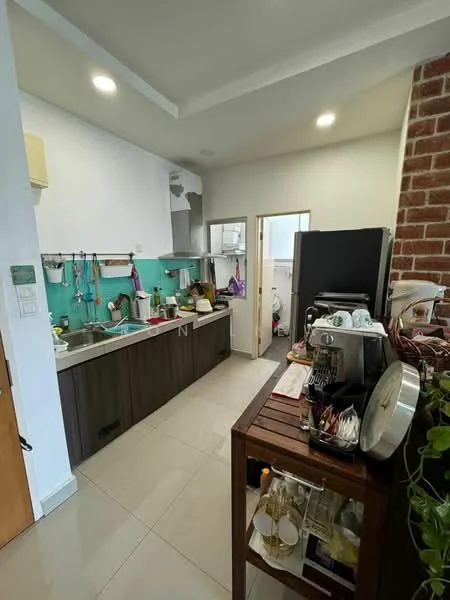 Kitchen features: L-shaped kitchen layout, dark wood cabinetry, light green backsplash, stainless-steel sink, chrome pull-down faucet, built-in stove, microwave, refrigerator, countertop with appliances, wall-mounted shelves, tile flooring, exposed brick wall, recessed downlights; style: modern.