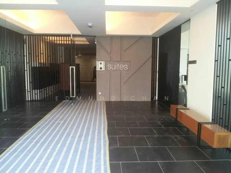 Room features: black tiled flooring, grey accent wall, glass entrance doors, metal partition with vertical bars, recessed ceiling lights, wooden bench, striped runner rug, elevator access, decorative wall panel, modern design elements; style: modern.