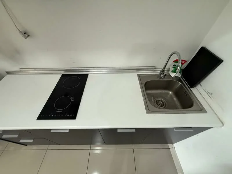 Kitchen features: white countertop, stainless-steel sink, chrome pull-down faucet, built-in induction cooktop, grey cabinetry, glossy tile flooring, wall-mounted dish soap dispenser, black cutting board; style: modern.