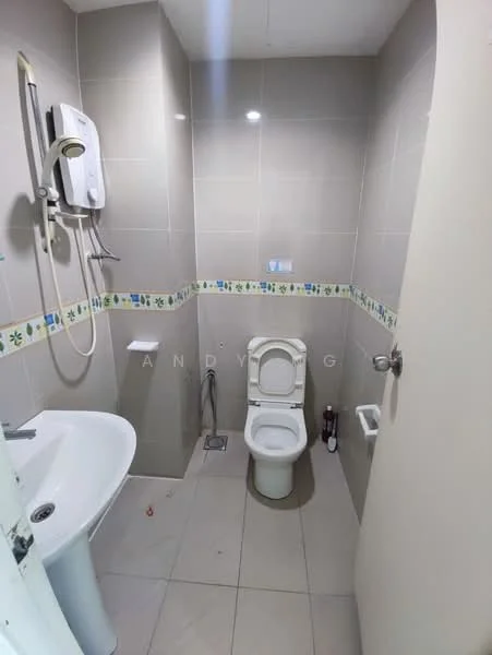 Bathroom features: white toilet, single-sink vanity with white cabinet, chrome basin mixer faucet, shower head with wall-mounted holder, tiled walls in light grey, decorative tile border with floral pattern, floor tiles in light grey, mirror above sink, toilet paper holder, soap dispenser, water heater, drain on floor; style: modern.