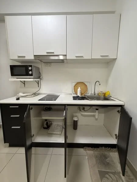 Kitchen features: white upper cabinets, black lower cabinets, stainless-steel sink, chrome pull-down faucet, white countertop, built-in electric cooktop, microwave oven, kitchen utensils visible, open cabinet with storage, tile flooring, wall-mounted range hood; style: modern.