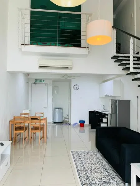 Living features: black fabric sofa, dining table for 6, white walls, tile flooring, recessed downlights, 1 wall-mounted split AC, clock on wall, area rug with geometric pattern, kitchenette with black cabinetry, stainless-steel fridge, built-in kitchen counter, open staircase with metal railing; style: modern.