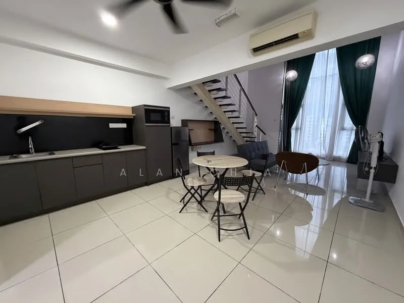 Kitchen features: grey cabinetry, black countertop, stainless-steel sink, chrome pull-down faucet, built-in microwave, refrigerator, 2-burner induction hob; style: modern. Dining features: round dining table, 4 black dining chairs; style: modern. Living features: 2-seater grey fabric sofa, ceiling fan, large floor-to-ceiling window with sheer curtains, wooden staircase; style: modern.