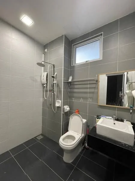 Bathroom features: grey tiled walls, black tiled flooring, walk-in shower with glass enclosure, rain shower head, handheld shower, toilet with dual flush, single-sink vanity with black cabinet, framed mirror, window for natural light, wall-mounted shower heater, towel rack; style: modern.
