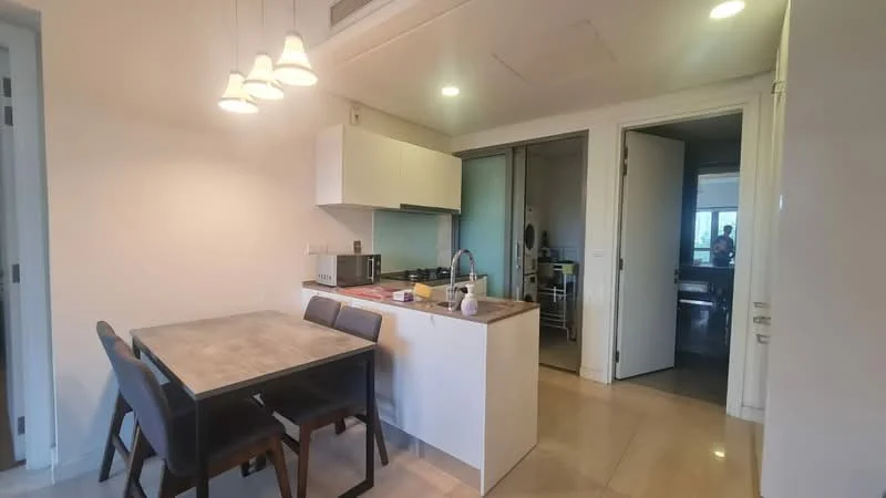 Kitchen features: white cabinetry, grey countertop, stainless-steel sink, chrome pull-down faucet, built-in microwave, freestanding range oven, 4-burner gas hob, pendant lighting, dining table with 4 chairs, tile flooring, recessed lighting; style: modern.