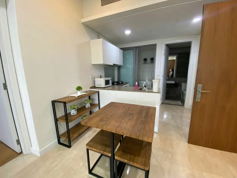 Kitchen features: white cabinetry, stainless-steel sink, chrome pull-down faucet, built-in microwave, freestanding range oven, kitchen island, wooden dining table, two wooden stools, open shelving, tile flooring, recessed downlights, neutral wall color; style: modern.