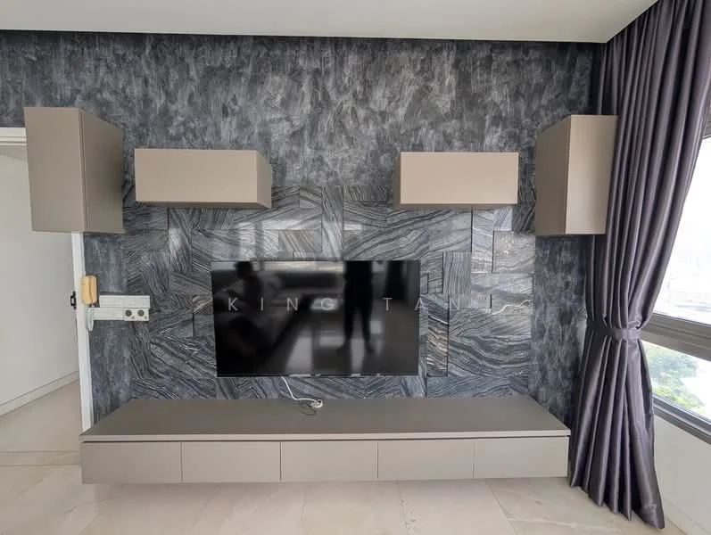 Living features: grey accent wall with textured finish, wall-mounted flat-screen TV, low-profile media console in beige, floating cabinets above media console in beige, floor-to-ceiling windows, dark curtains, light-colored flooring, visible electrical outlets; style: modern; view: city.