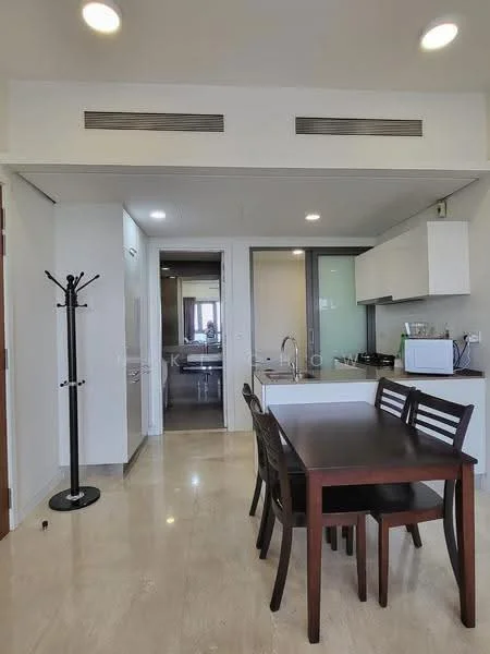 Dining features: dark wooden dining table, 4 wooden dining chairs, marble flooring, white cabinetry, stainless-steel sink, chrome pull-down faucet, built-in microwave, kitchen counter, recessed downlights, wall-mounted coat rack, open layout to kitchen, neutral wall color; style: modern. Kitchen features: white cabinetry, stainless-steel sink, chrome pull-down faucet, built-in microwave, kitchen counter, recessed downlights; style: modern. Room features: marble flooring, neutral wall color, recessed downlights.