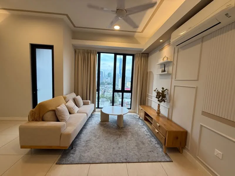 Living features: 3-seater fabric sofa in beige, round coffee table, TV console with wooden finish, area rug with grey pattern, floor-to-ceiling windows, curtains, recessed downlights, ceiling fan, wall-mounted air conditioning unit, decorative wall paneling, light-colored walls, tile flooring; style: modern; view: city.