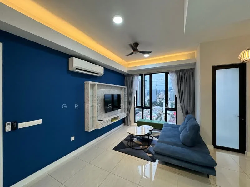 Living features: blue accent wall, white painted walls, marble tile flooring, 5-blade ceiling fan with light, recessed LED downlights, wall-mounted TV, white TV console, round coffee table, L-shape sectional sofa in blue, floor-to-ceiling windows, sheer curtains, city view; style: modern; view: city.