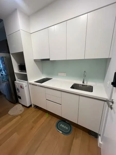 Kitchen features: white cabinetry, double-bowl stainless-steel sink, chrome pull-down faucet, white quartz countertop, light green backsplash, built-in microwave, stainless-steel fridge, wooden flooring, kitchen mat with 'HOME' text; style: modern.