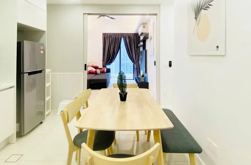 Dining features: light wood dining table, 4 wooden dining chairs, green upholstered bench, white walls, recessed downlights, floor-to-ceiling windows, city view, air conditioning unit, decorative plant on table, grey accent wall; style: modern; view: city. Kitchen features: stainless-steel fridge, white cabinetry, countertop with integrated sink, ceramic tile flooring; style: modern.