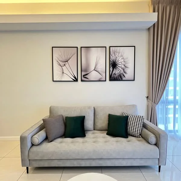 Living features: grey fabric 3-seater sofa, decorative cushions in green and patterned fabric, white round coffee table, framed black and white artwork on walls, light-coloured painted walls, floor-to-ceiling windows with sheer curtains, tile flooring, recessed ceiling lights; style: modern; view: city.
