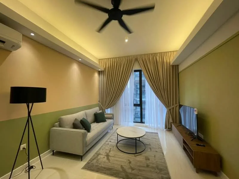 Living features: light grey fabric sofa, green accent wall, cream painted walls, round coffee table with black base, area rug with geometric pattern, floor-to-ceiling windows, sheer curtains, wall-mounted TV, TV console, 5-blade ceiling fan with light, recessed downlights, decorative wall sconce; style: modern.