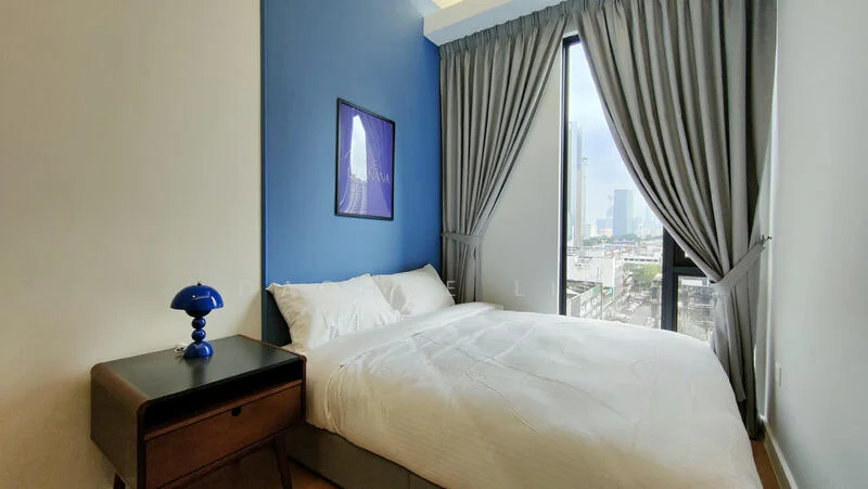 Bedroom features: queen-size bed with white bedding, blue accent wall, white painted walls, floor-to-ceiling windows, grey curtains, nightstand with drawer, table lamp with blue base, wooden flooring; style: modern; view: city.