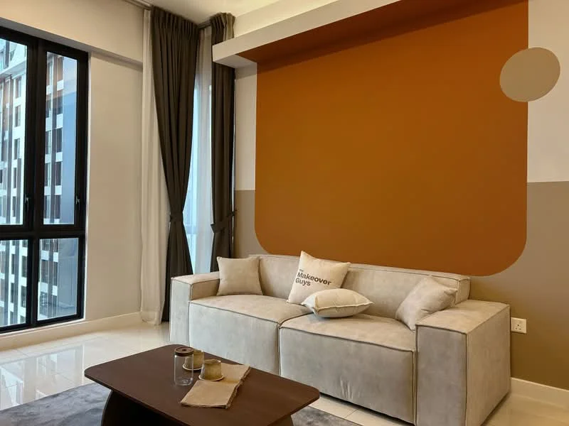 Living features: beige fabric sofa, decorative throw pillow with text, brown coffee table, white walls with orange accent wall, floor-to-ceiling windows, curtains in dark grey, glossy tile flooring, wall-mounted decor; style: modern; view: city.