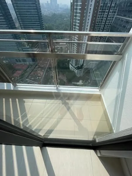 Balcony features: glass railing, tile flooring, city skyline view, sliding glass door, sunlight casting shadows; style: modern; view: city.