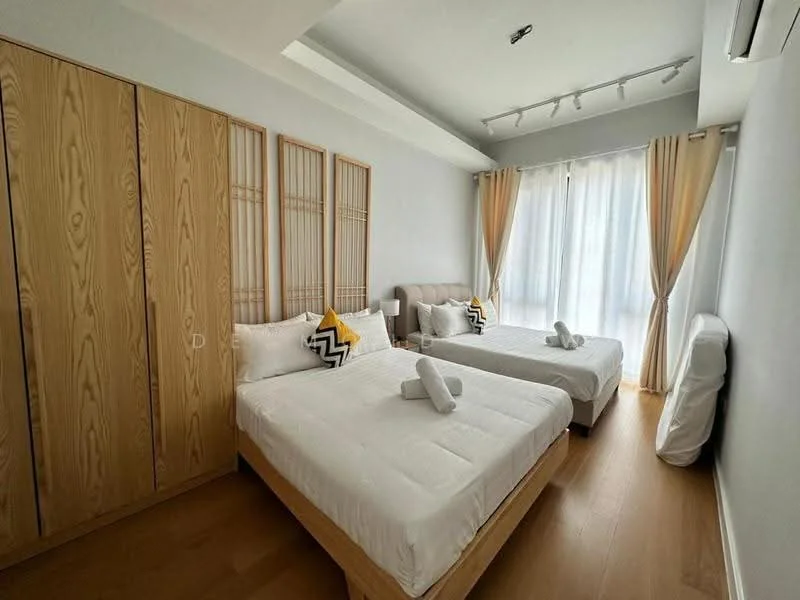 Bedroom features: two queen-size beds with white bedding, upholstered headboard in beige, wooden wardrobe with sliding doors, wooden flooring, floor-to-ceiling windows with sheer curtains, decorative throw pillows in black and yellow, two rolled towels on beds, track lighting on ceiling; style: modern.