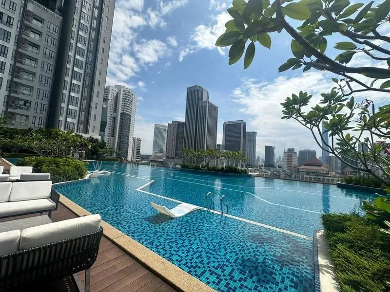 Exterior type: high-rise condominium; features: infinity pool, pool deck with loungers, surrounded by landscaped greenery, city skyline view, tiled pool surface, decking area, modern architecture, high-rise buildings in background; style: modern.