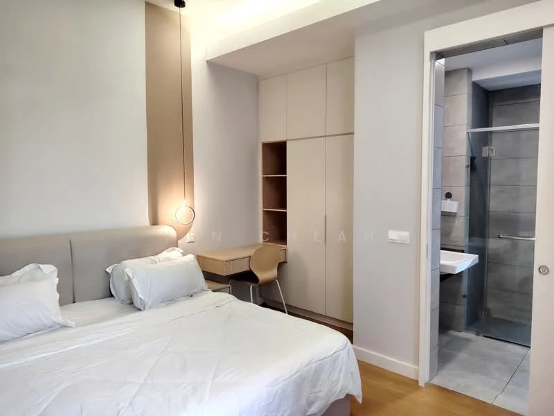 Bedroom features: queen-size bed with upholstered headboard, white bedding, wooden flooring, built-in wardrobe with sliding doors, study desk with chair, wall-mounted light fixture, neutral wall color, large window with natural light; style: modern. Bathroom features: wall-mounted sink, mirror above sink, grey tile flooring, glass shower enclosure, modern faucet, neutral wall color.