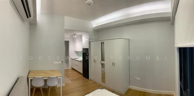 Room features: light wood flooring, white painted walls, recessed ceiling lights, ceiling fan, built-in wardrobe with sliding doors, small dining table with two chairs, kitchenette with white cabinetry, black refrigerator, countertop with sink; style: modern.