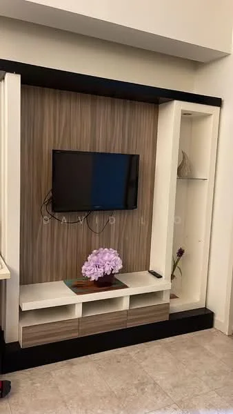 Living features: wall-mounted TV, light wood paneling, white shelving unit, black accent trim, decorative plant on shelf, coffee table, purple flower arrangement, floor tiles, built-in storage cabinets; style: modern.