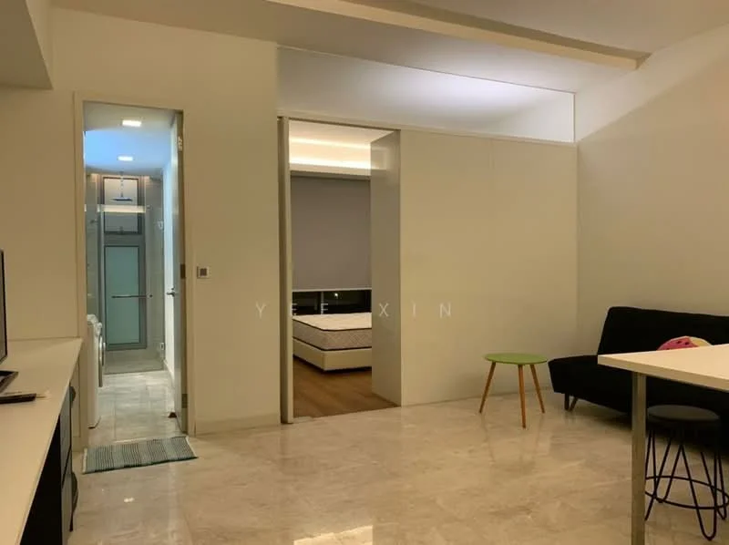 Living features: marble tile flooring, white painted walls, recessed downlights, sofa in black fabric, small round green side table, TV console, wall-mounted TV, open layout, natural light from window; style: modern. Room features: white painted walls, doorway leading to bedroom, glass shower enclosure visible, tile flooring, light fixture, unknown room beyond doorway.