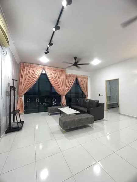 Living features: white painted walls, glossy white tile flooring, 5-blade ceiling fan with light, track lighting, large floor-to-ceiling windows, sheer curtains, dark grey fabric sofa, coffee table with white top, decorative wall panel, curtains in peach color; style: modern; view: city.