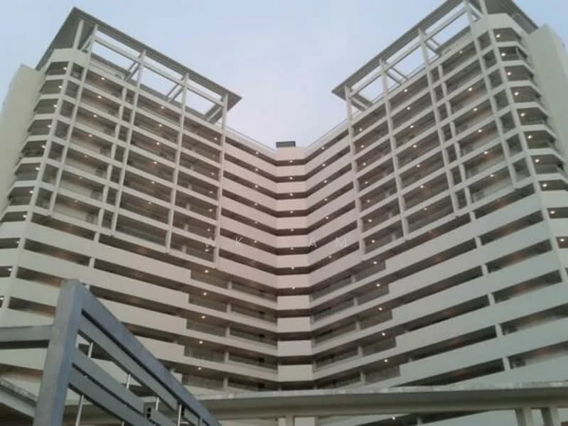 Exterior type: mid-rise condominium; features: white painted facade, balconies on each floor, multiple levels, open-air parking, modern architectural design, large windows, exposed concrete, flat roof; style: modern.
