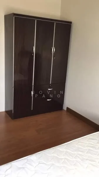 Bedroom features: dark wood wardrobe with sliding doors, wooden flooring, white walls, single bed frame, unmade mattress.