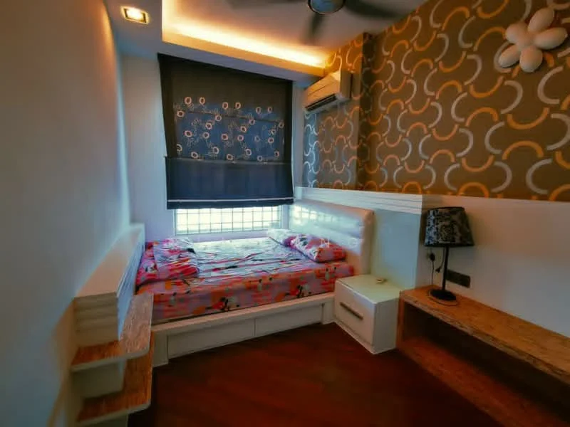 Bedroom features: queen-size bed with floral bedding, upholstered headboard, wooden bedside table, decorative lamp, wall-mounted air conditioning unit, floor-to-ceiling window with black roller blinds, feature wall with abstract pattern, wooden flooring, ceiling fan; style: modern.