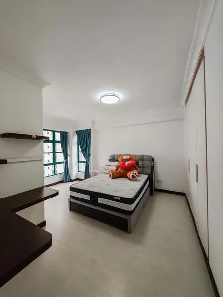 Bedroom features: queen-size bed, upholstered headboard, decorative teddy bear, built-in wardrobe, white painted walls, light-colored flooring, floor-to-ceiling windows, curtains in dark blue, ceiling light fixture; style: modern.