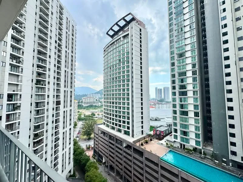 Exterior type: high-rise condominium; features: glass curtain wall, balconies on upper floors, swimming pool deck, multi-storey car park, surrounded by other high-rise buildings, view of city skyline, landscaped garden area, parking deck, outdoor amenities; style: modern.