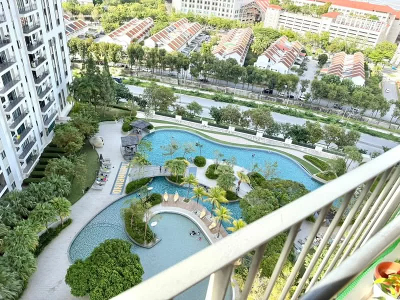 Exterior type: high-rise condominium; features: infinity pool, landscape garden, manicured lawn, palm trees, children's playground, pool deck with loungers, water features, surrounded by greenery, view of residential area, adjacent to main road; style: modern.