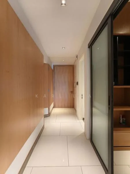 Hallway features: light-coloured tiled flooring, wooden wall paneling, glass sliding door, recessed ceiling lights, neutral wall colour, built-in storage cabinets, solid wooden door, minimalist design; style: modern.