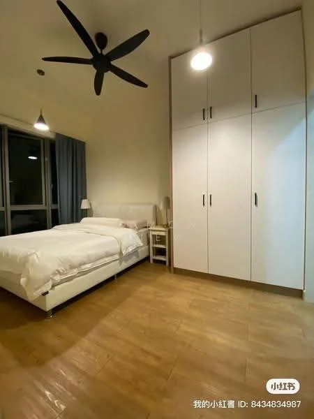 Bedroom features: queen-size bed with white bedding, 2 bedside tables, table lamp on bedside table, built-in wardrobe with white doors, wooden flooring, 5-blade ceiling fan, floor-to-ceiling windows with sheer curtains, light grey wall, decorative wall art; style: modern.
