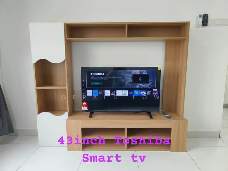 Living features: wooden TV console, 43-inch Toshiba smart TV, open shelving unit, white accent panel, light-colored wall, white tiled flooring, curtains, remote control on wall, wall-mounted electrical outlets; style: modern.