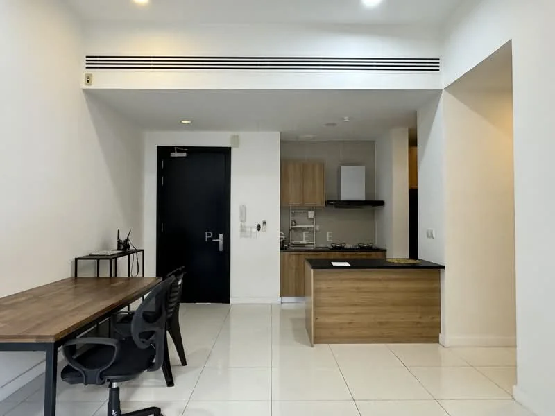 Kitchen features: white painted walls, polished tile flooring, kitchen island with black countertop, wood cabinetry, built-in oven, stainless-steel range hood, 4-burner gas hob, single-bowl stainless-steel sink, chrome pull-down faucet, recessed downlights; style: modern. Dining features: wood dining table, black plastic chairs; style: modern.