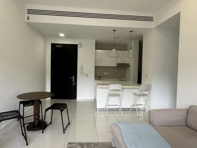 Living features: white painted walls, glossy tile flooring, sofa in light grey fabric, round dining table with dark wood base, two black metal stools, pendant lighting above kitchen island, kitchen island with white countertop, built-in kitchen cabinetry, stainless-steel range hood, open layout connecting living and kitchen areas; style: modern.