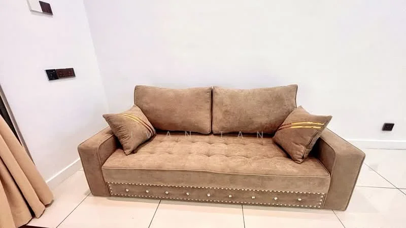 Living features: fabric sofa in beige, tufted upholstery, decorative cushions with gold accents, studded detailing on sofa base, white painted walls, glossy tile flooring, wall-mounted light switches, curtains in beige fabric; style: modern.