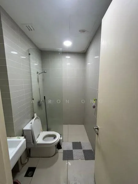 Bathroom features: white tiled walls, grey tiled flooring, walk-in shower with glass enclosure, chrome handheld shower, one-piece toilet, single-sink vanity with white cabinet, mirror above sink, recessed downlights; style: modern.