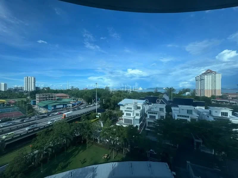 Exterior features: city skyline view, green landscaping, nearby road with traffic, multi-storey buildings in the background, open sky with clouds.