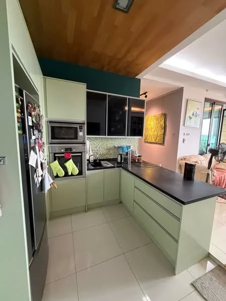 Kitchen features: green cabinetry, black countertop, stainless-steel fridge, built-in oven, microwave, ceramic tile flooring, glass tile backsplash, kettle, toaster, dishwasher, under-cabinet lighting, open shelving, wall-mounted cabinets, pantry, decorative artwork on wall; style: modern.