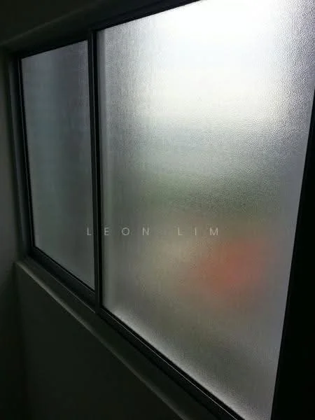 Room features: frosted glass windows, black window frame, view obscured, natural light filtering through.