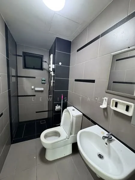 Bathroom features: grey tile walls, black tile accents, ceramic tile flooring, one-piece toilet, wall-mounted basin, chrome faucet, shower with glass enclosure, rain shower head, mirror with frame, wall-mounted soap dispenser, towel rail, window for natural light, ceiling light fixture; style: modern.