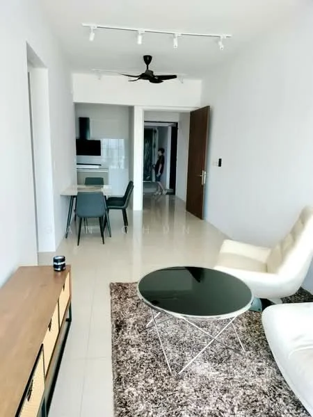 Living features: white painted walls, glossy tile flooring, 5-blade ceiling fan with light, recessed downlights, large area rug with geometric pattern, glass coffee table, 2-seater leather sofa in white, wooden sideboard with storage, dining table with 4 chairs, open layout to kitchen, floor-to-ceiling windows, neutral color palette; style: modern.