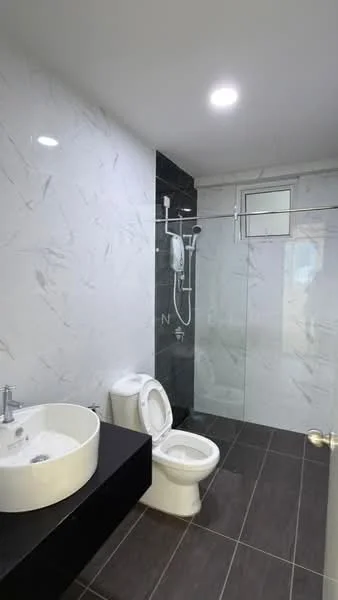 Bathroom features: white ceramic toilet, single-sink vanity with round basin, black countertop, glass shower enclosure, rain shower head, handheld shower, marble tile walls with grey veining, dark grey ceramic tile flooring, recessed LED downlights, mirror above vanity; style: modern.