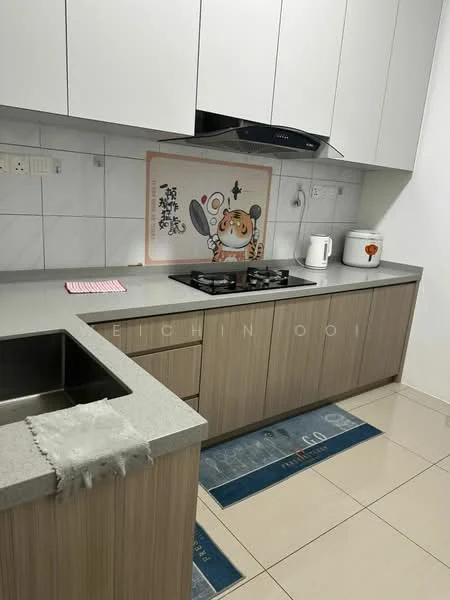 Kitchen features: grey countertop, light wood cabinetry, white tiled backsplash, built-in gas hob, stainless-steel range hood, white kettle, white rice cooker, decorative wall art, floor tiles, pink dish towel, blue kitchen mat; style: modern.