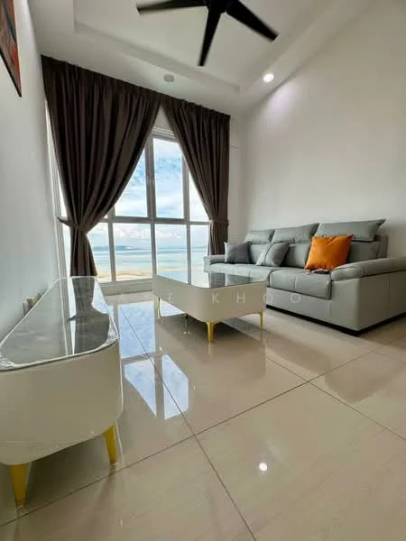 Living features: floor-to-ceiling windows, grey fabric sectional sofa, orange throw pillow, white coffee table with gold legs, white side table with gold legs, curtains in dark brown, polished tile flooring, recessed downlights, ceiling fan; style: modern; view: sea.